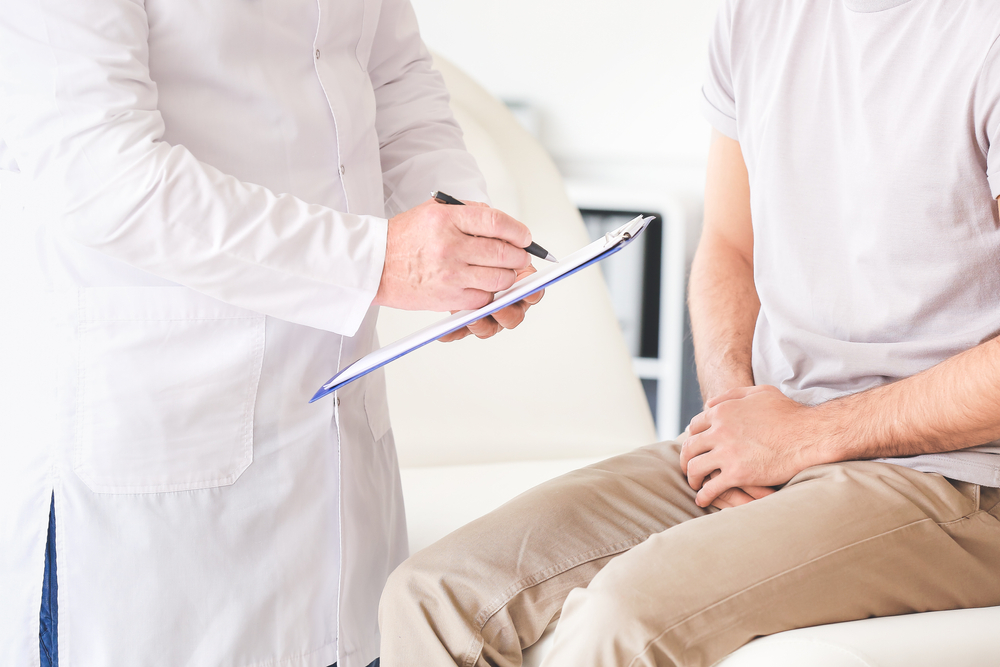 man talking with urologist at appointment